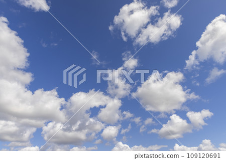 sunny weather with white clouds on a blue sky background sunny weather with white clouds on a blue sky background 109120691