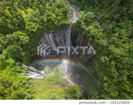 Rainbow at Tumpak Sewu Waterfall. East Java. Indonesia. Stunning aerial view 109120809