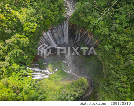 Rainbow at Tumpak Sewu Waterfall. East Java. Indonesia. Stunning aerial view Rainbow at Tumpak Sewu Waterfall. East Java. Indonesia. Stunning aerial view 109120810