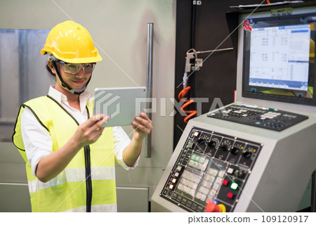 factory worker use tablet to command microchip machine factory worker use tablet to command microchip machine 109120917