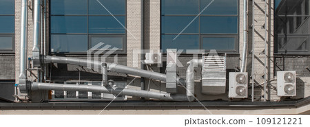 Air ventilation tube system and external air conditioners on the facade of a city building 109121221