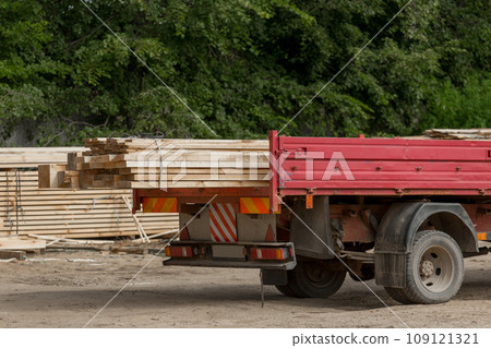 Car automobile with trailer wooden planks material. Wood Industry and Transportation 109121321