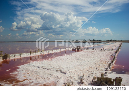 Clouds landscape water and horizon - salt mining plant Clouds landscape water and horizon - salt mining plant 109122350