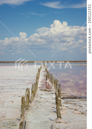 Clouds landscape water and horizon - salt mining plant Clouds landscape water and horizon - salt mining plant 109122351