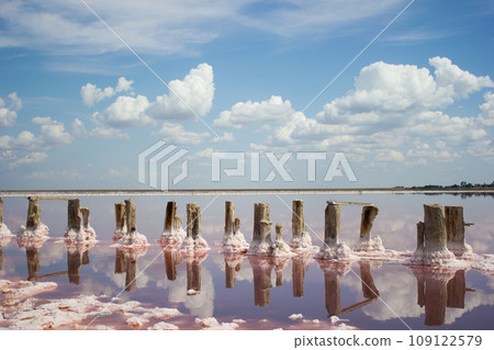 Clouds landscape water and horizon - salt mining plant Clouds landscape water and horizon - salt mining plant 109122579