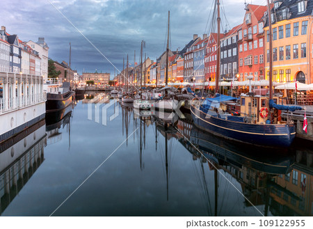Copenhagen. Nyhavn canal colorful traditional houses and city embankment at sunrise. Copenhagen. Nyhavn canal colorful traditional houses and city embankment at sunrise. 109122955