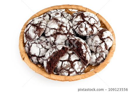 Chocolate brownie cookie in a wicker basket isolated on white background. Top view. Flat lay 109123556