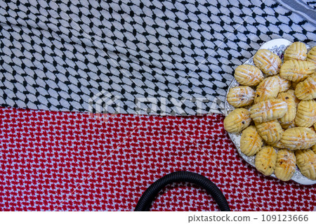 Eid maamoul on arabic traditional shemagh white and red Eid maamoul on arabic traditional shemagh white and red 109123666