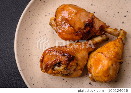 Delicious Asian dish with chicken legs in teriyaki sauce with salt and spices Delicious Asian dish with chicken legs in teriyaki sauce with salt and spices 109124036