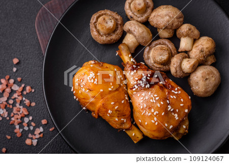 Delicious Asian dish with chicken legs in teriyaki sauce with salt and spices Delicious Asian dish with chicken legs in teriyaki sauce with salt and spices 109124067