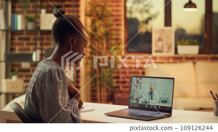 Woman asking doctor for advice using videocall connection, attending telemedicine conference with specialist to help with health problem. Person at online consultation, support service. Woman asking doctor for advice using videocall connection, attending telemedicine conference with specialist to help with health problem. Person at online consultation, support service. 109126244