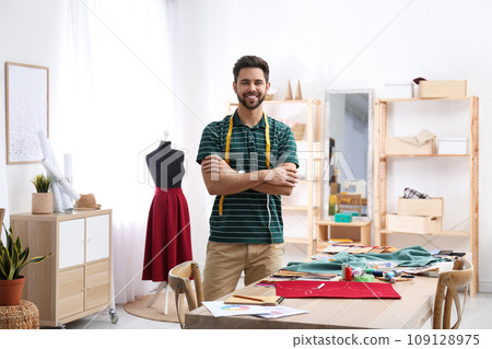 Fashion designer creating new clothes in studio 109128975