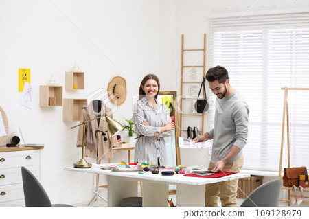 Fashion designers creating new clothes in studio 109128979