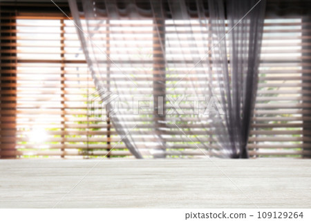 Empty wooden table in room. Space for design 109129264