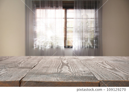 Empty wooden table in room. Space for design Empty wooden table in room. Space for design 109129270