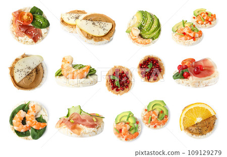 Set of puffed rice cakes with different ingredients on white background 109129279