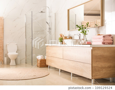 Interior of stylish bathroom with shower unit 109129324