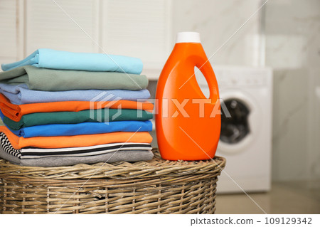 Fresh laundry and detergent on basket in bathroom 109129342