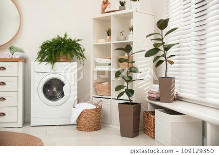 Elegant interior of modern bathroom with green plants Elegant interior of modern bathroom with green plants 109129350