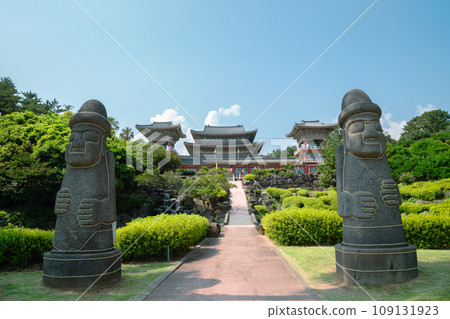 Yakcheonsa Temple and Dol hareubang in Jeju Island, Korea Yakcheonsa Temple and Dol hareubang in Jeju Island, Korea 109131923