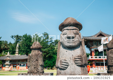 Yakcheonsa Temple and Dol hareubang in Jeju Island, Korea 109131925