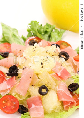Tosa Pomelo and prosciutto salad, large citrus fruits, bright background 109136311