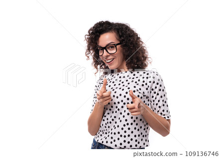 young confident curly secretary woman with glasses is dressed in a blouse with mug print 109136746