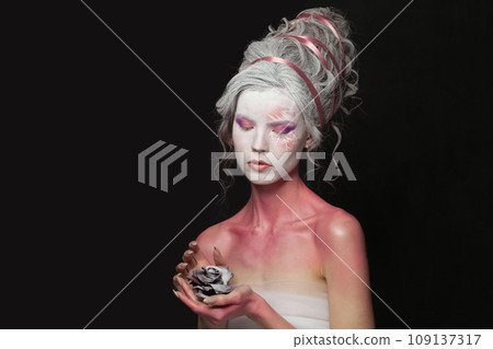Glamorous woman with makeup. Halloween and theatre concept. 109137317