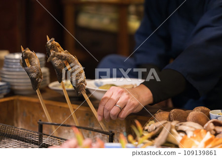 Grilling fish on the hearth, close-up view Grilling fish on the hearth, close-up view 109139861