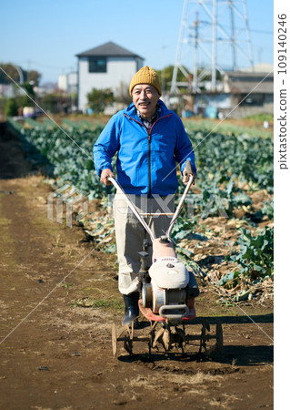 man with tiller man with tiller 109140246