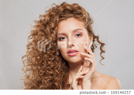 Glamorous redhead model woman with long healthy wavy hairstyle, perfect clean fresh skin  109140257