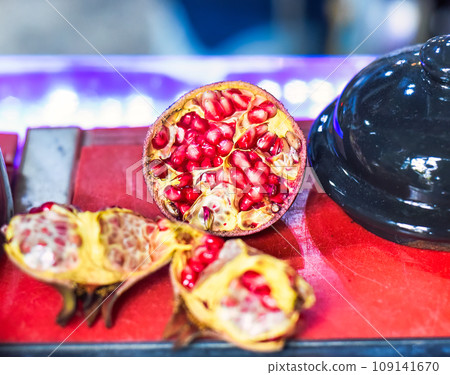 Ripe peeled Pomegranate fruit on a table 109141670