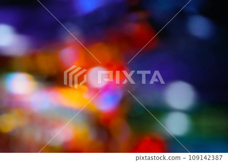 A fun-looking image with lots of colorful blurred lights on a dark background. A fun-looking image with lots of colorful blurred lights on a dark background. 109142387