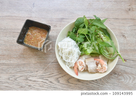 rice noodles with boiled shrimp and slice pork belly eat couple variety vegetable salad dressing chili sauce on plate rice noodles with boiled shrimp and slice pork belly eat couple variety vegetable salad dressing chili sauce on plate 109143995