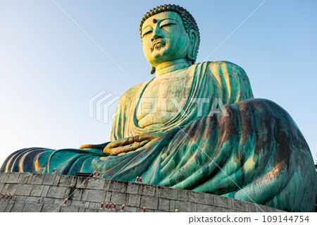 Low angle view of big Seated Buddha Statue on the top of mountain. 109144754