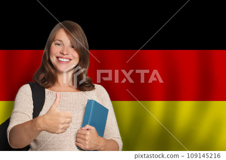 Cute woman student against German flag background. Travel, education and learn language Cute woman student against German flag background. Travel, education and learn language 109145216