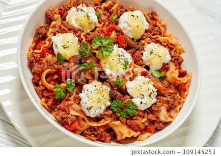 Lasagnette with ground beef in bowl, top view Lasagnette with ground beef in bowl, top view 109145251