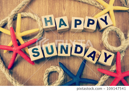 Happy sunday alphabet letters with nautical decoration on wooden background 109147541
