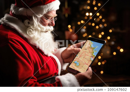 Santa Claus uses a tablet computer to order gifts and use GPS to find addresses Santa Claus uses a tablet computer to order gifts and use GPS to find addresses 109147602