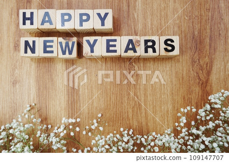 hapy new years alphabet letters on wooden background 109147707