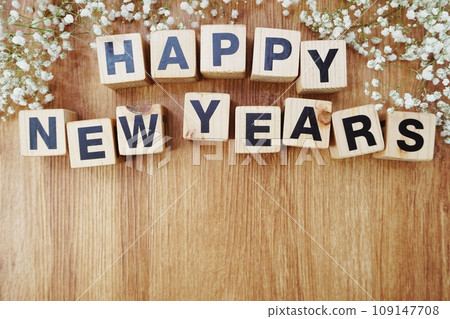 happy new years alphabet letters on wooden background 109147708