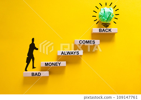 Business concept growth success process. Wood blocks stacking as step stair on yellow background, copy space. Businessman icon. Words 'bad money always comes back'. Conceptual image of motivation. 109147761