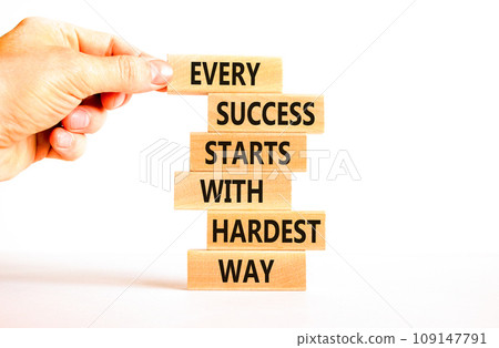 Success symbol. Concept words Every success starts with hardest way on wooden block. Beautiful white table white background. Businessman hand. Business success and hardest way concept. Copy space. Success symbol. Concept words Every success starts with hardest way on wooden block. Beautiful white table white background. Businessman hand. Business success and hardest way concept. Copy space. 109147791