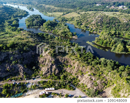 Winding bed of the Southern Bug river. River, landscape from a bird's eye view. Rough, rocky terrain. 109148009
