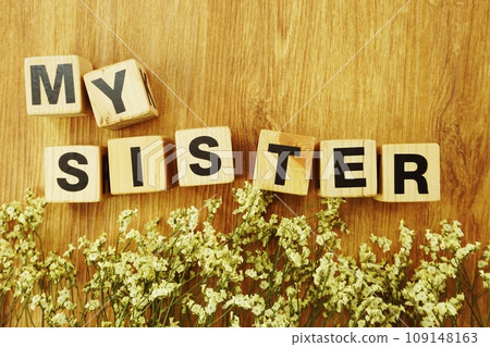 my sister alphabet letters on wooden background 109148163