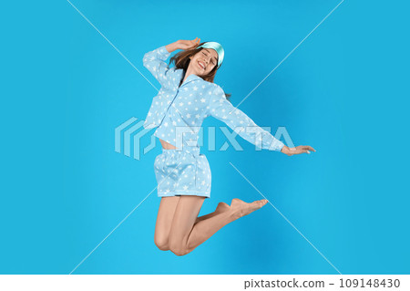 Woman with flower showing smooth skin after bikini epilation on pink background, closeup 109148430