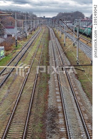 Photography to theme railway track after passing train on railroad Photography to theme railway track after passing train on railroad 109149042