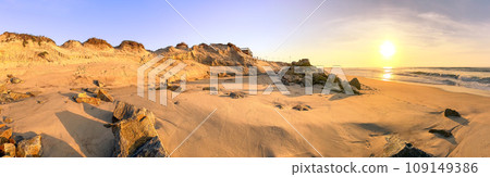 Damages on the dunes and rock walls on the seafront 109149386