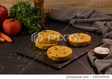 Raw veggie burger with chickpeas and vegetables Raw veggie burger with chickpeas and vegetables 109149456