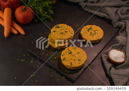 Raw veggie burger with chickpeas and vegetables Raw veggie burger with chickpeas and vegetables 109149459